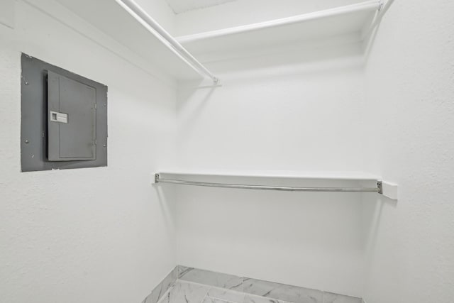 spacious closet featuring electric panel