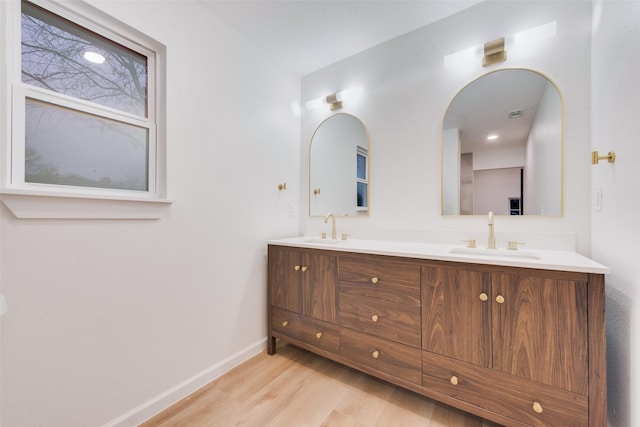 bathroom featuring vanity and wood-type flooring