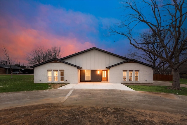 view of front of house with a yard