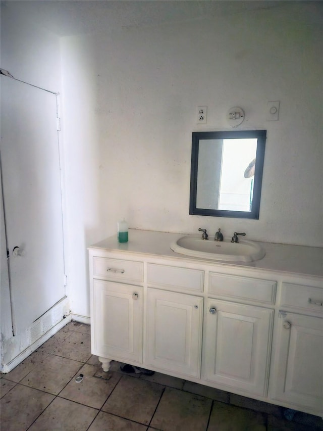 bathroom featuring tile patterned flooring and vanity