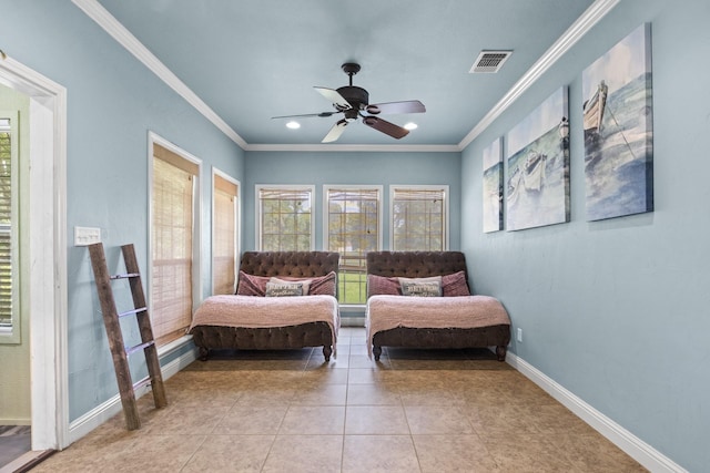 living area featuring crown molding, ceiling fan, and light tile patterned floors