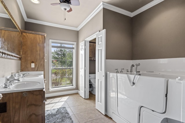 bathroom with ornamental molding, tile patterned floors, toilet, and vanity