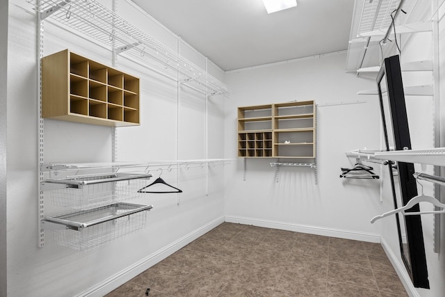 spacious closet featuring tile patterned floors