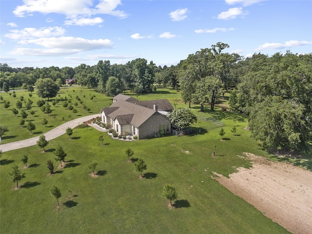 birds eye view of property with a rural view