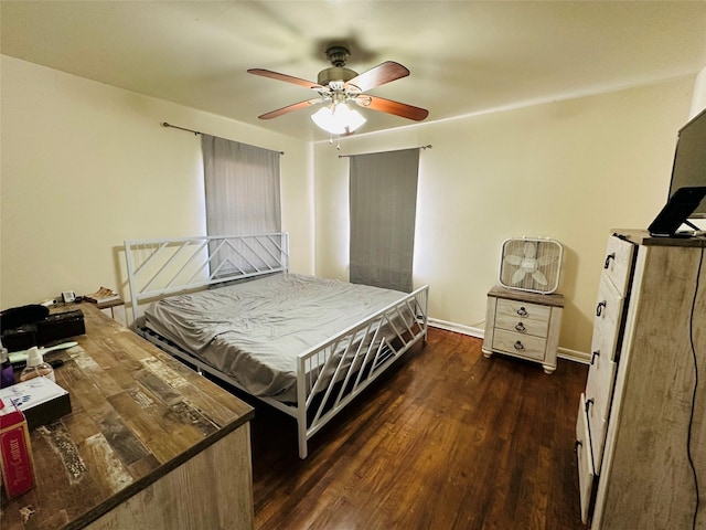 bedroom featuring ceiling fan and dark hardwood / wood-style flooring