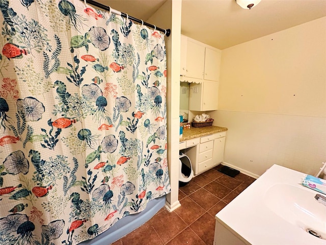 bathroom featuring vanity, tile patterned flooring, and shower / bath combo