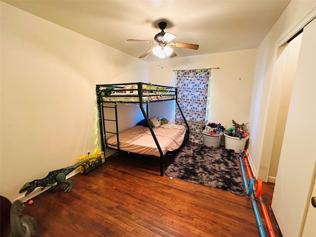 bedroom featuring wood-type flooring and ceiling fan