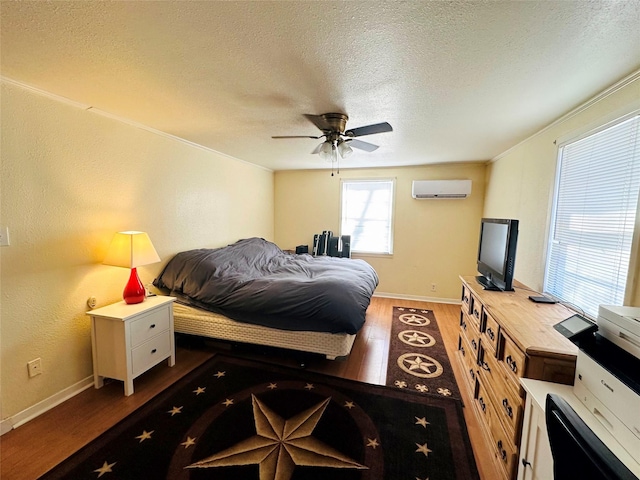 bedroom with a textured ceiling, dark wood-type flooring, a wall mounted AC, and ceiling fan