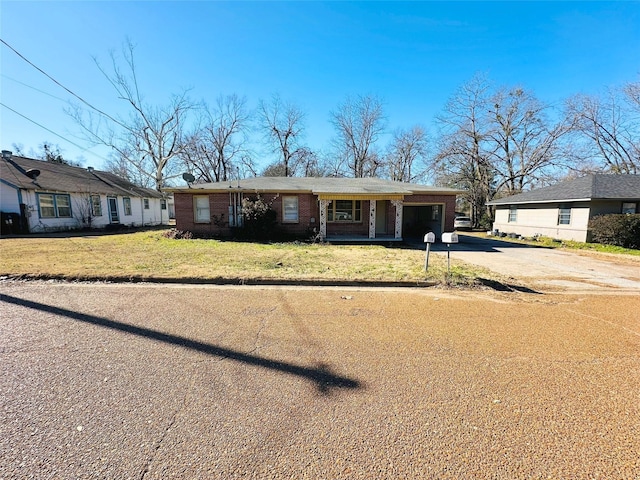 ranch-style home with a front yard