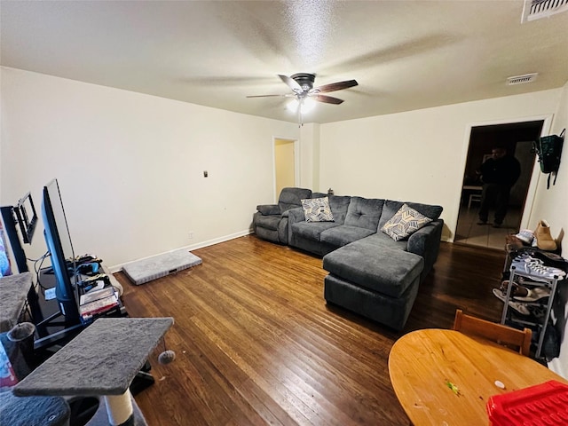 living room with hardwood / wood-style flooring and ceiling fan