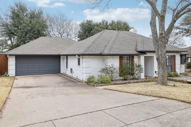 ranch-style home with a garage