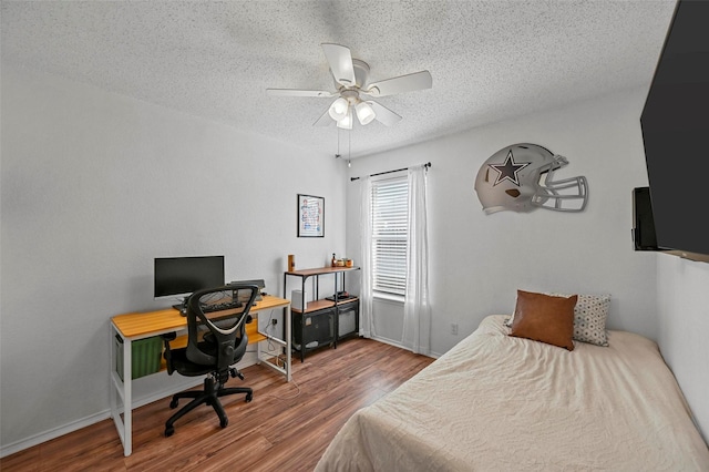 bedroom with hardwood / wood-style flooring, a textured ceiling, and ceiling fan