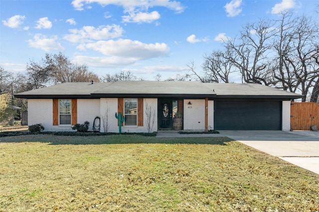 ranch-style home featuring a garage and a front lawn