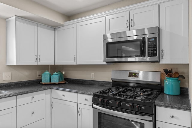 kitchen featuring white cabinetry and appliances with stainless steel finishes