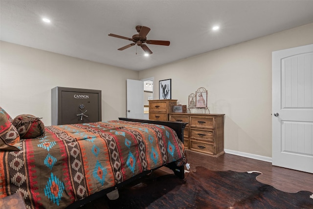 bedroom with dark wood-type flooring and ceiling fan