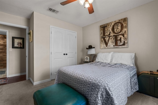 bedroom with ceiling fan, carpet flooring, and a closet