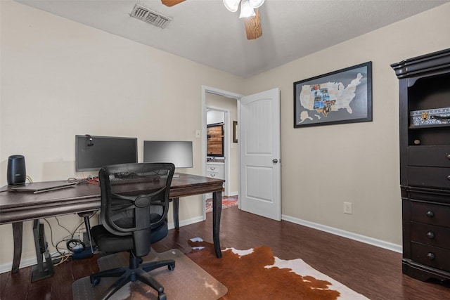 office area featuring dark wood-type flooring and ceiling fan