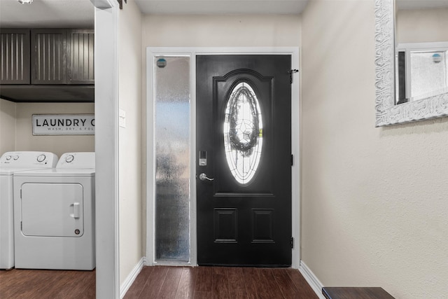 entrance foyer featuring dark hardwood / wood-style flooring and washing machine and dryer