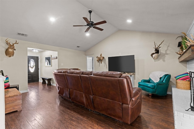 living room with dark wood-type flooring, ceiling fan, and vaulted ceiling