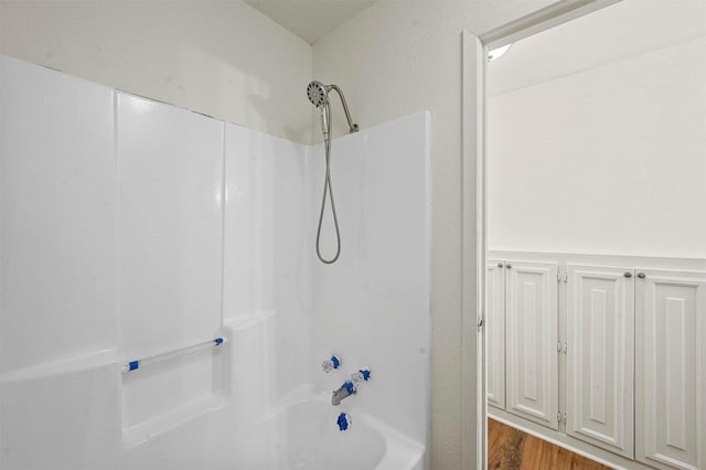 bathroom with bathing tub / shower combination