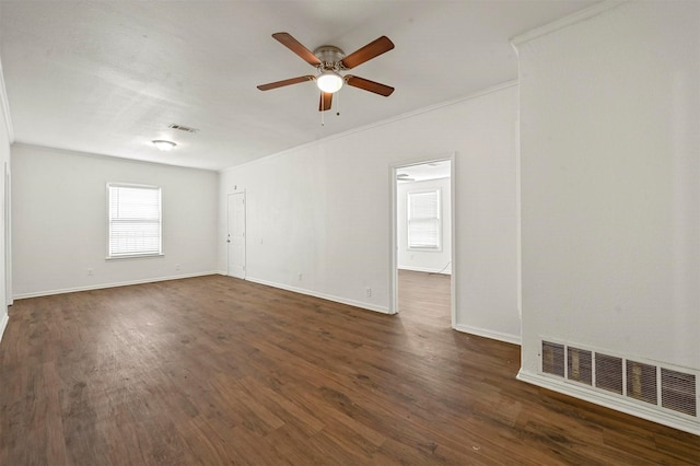 empty room featuring crown molding, ceiling fan, and dark hardwood / wood-style flooring