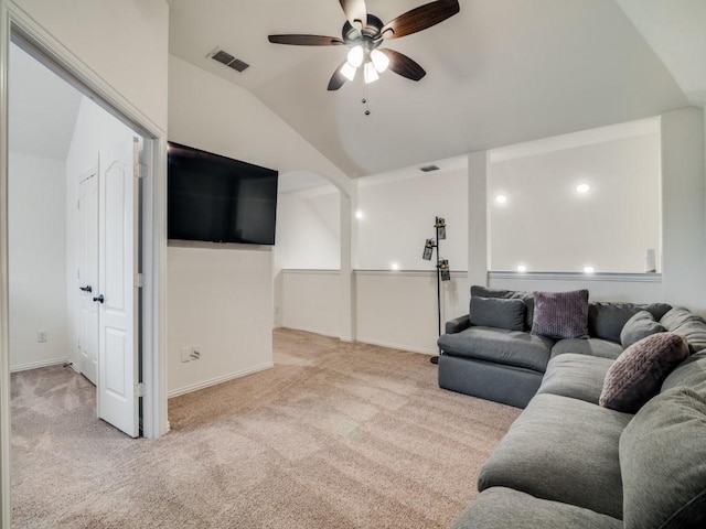 carpeted living room with vaulted ceiling and ceiling fan