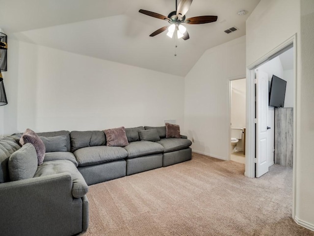 living room with lofted ceiling, light colored carpet, and ceiling fan