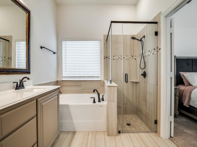 bathroom featuring vanity and plus walk in shower