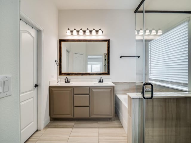 bathroom with vanity, tile patterned floors, and separate shower and tub