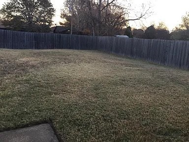 view of yard at dusk