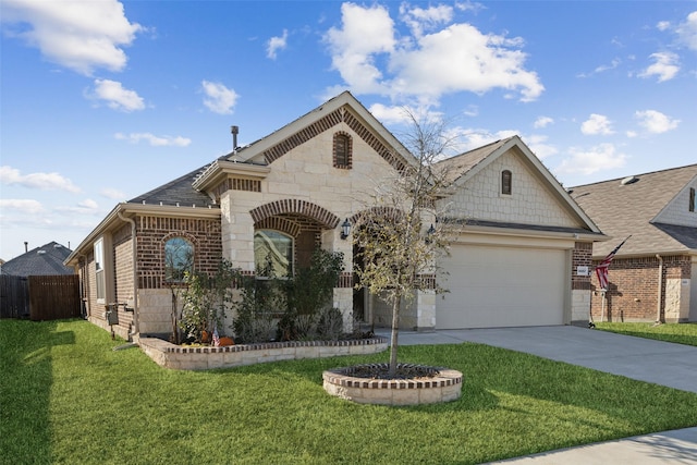 view of front of home featuring a garage and a front lawn