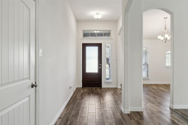 foyer entrance featuring a chandelier