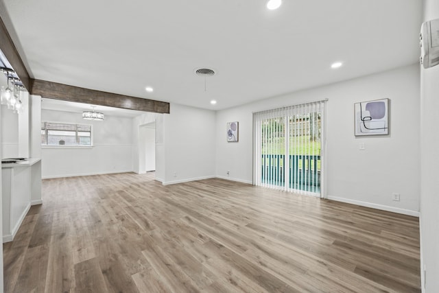 unfurnished living room with light hardwood / wood-style floors