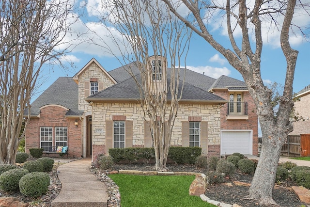 french country home with a garage