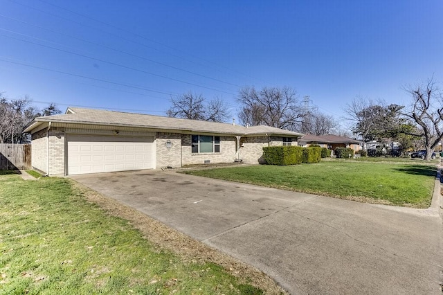 view of front of property featuring brick siding, fence, a garage, driveway, and a front lawn