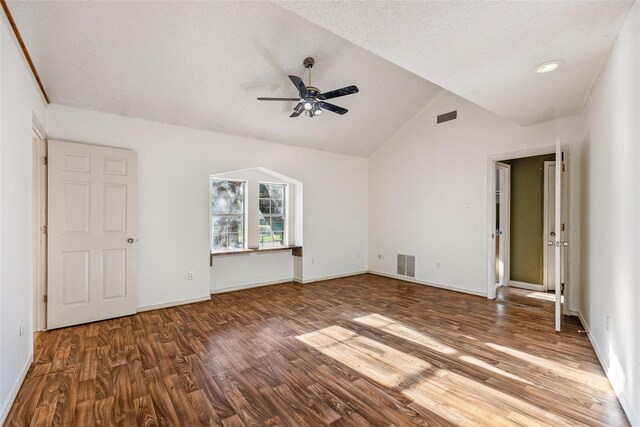 interior space with lofted ceiling, hardwood / wood-style floors, a textured ceiling, and ceiling fan