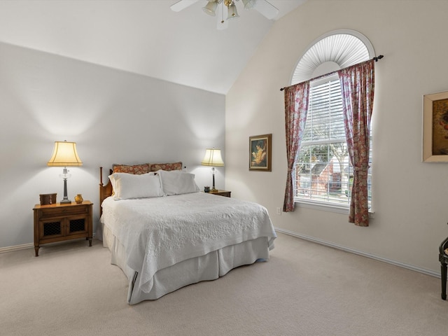 carpeted bedroom with lofted ceiling and ceiling fan