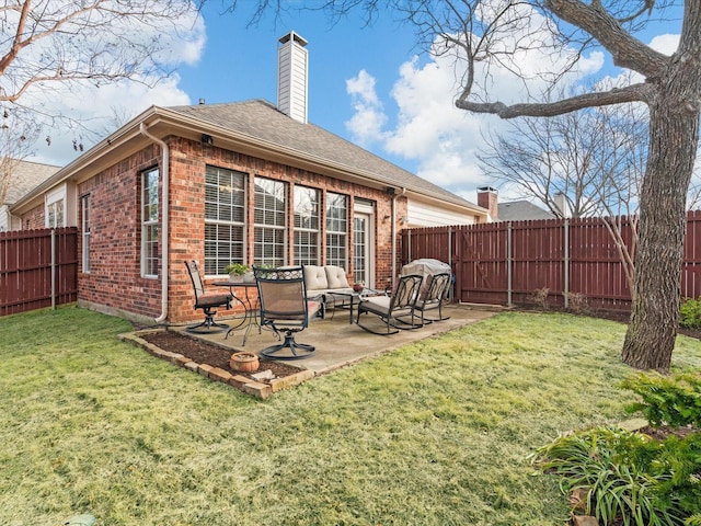 back of property featuring an outdoor living space, a patio, and a lawn