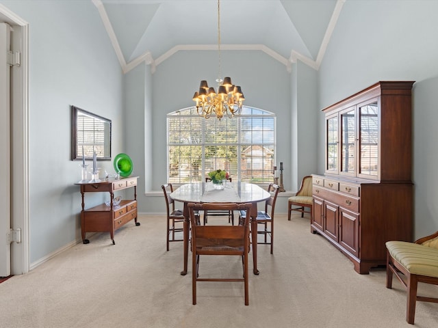 dining space featuring light colored carpet, high vaulted ceiling, and a notable chandelier