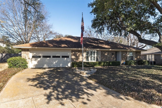 ranch-style home featuring a garage