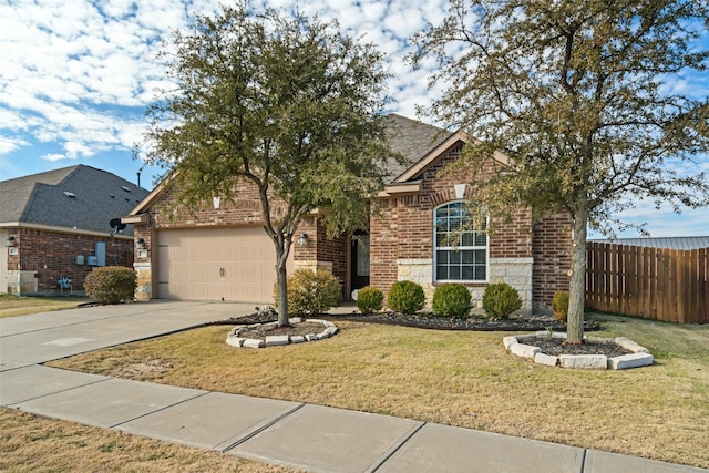 view of property featuring a garage and a front yard