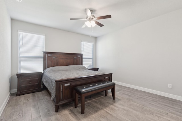 bedroom with light hardwood / wood-style flooring and ceiling fan