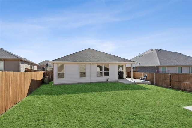 rear view of property featuring a patio and a lawn