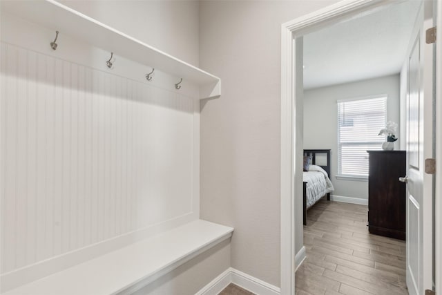 mudroom with hardwood / wood-style floors