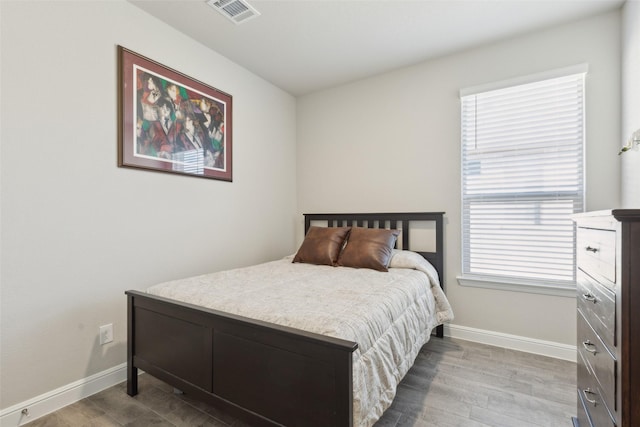 bedroom featuring hardwood / wood-style floors