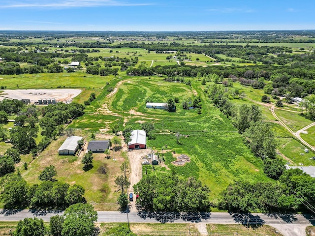 birds eye view of property featuring a rural view