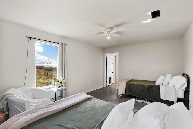 bedroom with ceiling fan and dark hardwood / wood-style floors