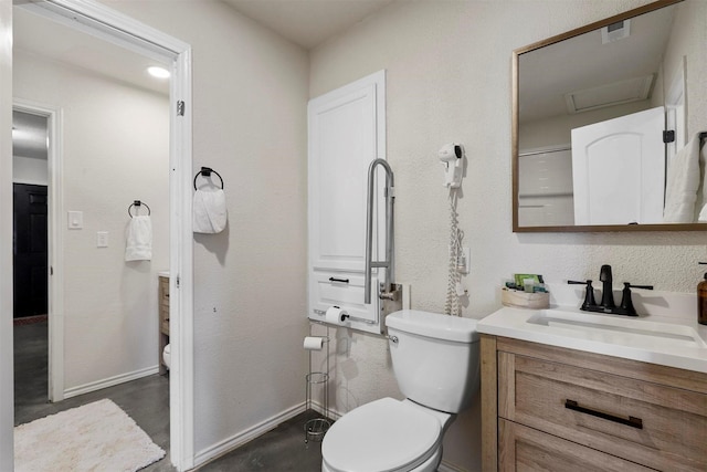 bathroom featuring vanity and toilet