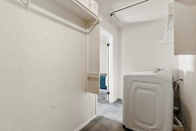 washroom with washer / clothes dryer