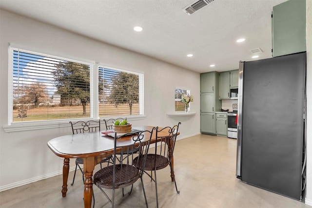 dining room featuring a textured ceiling